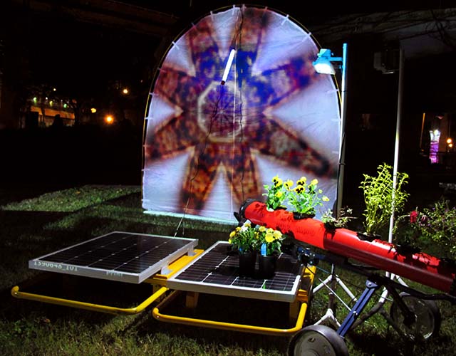 moth tent with solar panels and plants