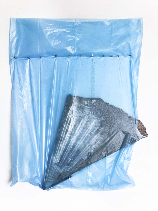 rock tearing through plastic bag