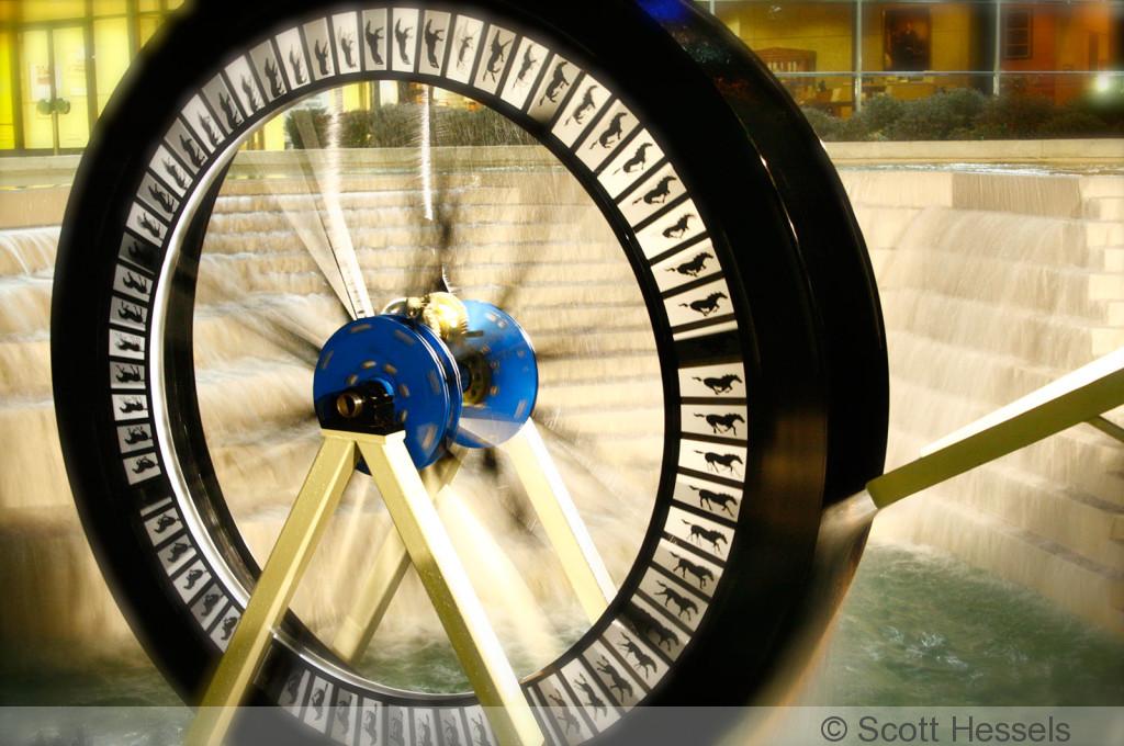wheel with images being turned by water