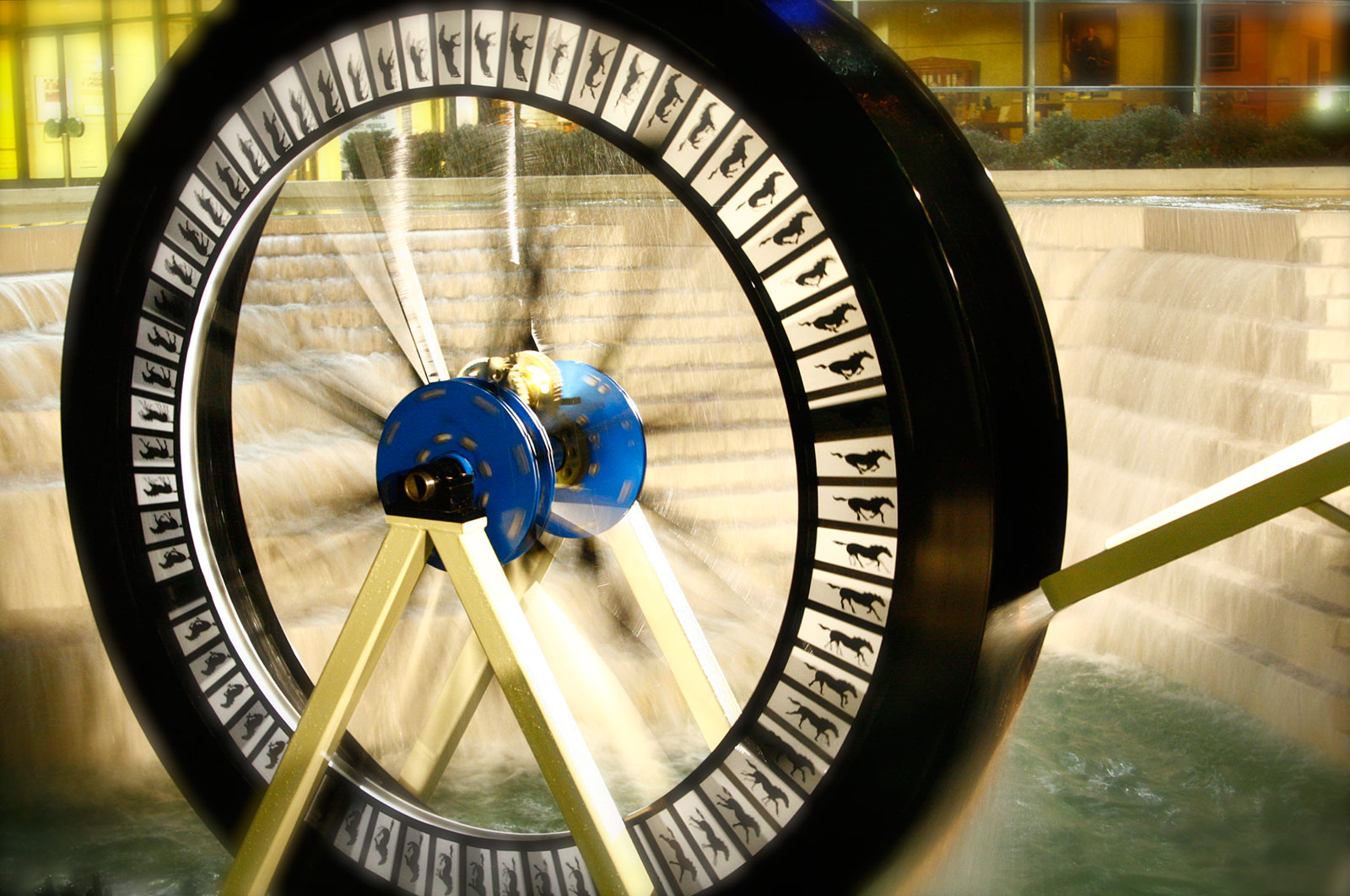 wheel with images being turned by water