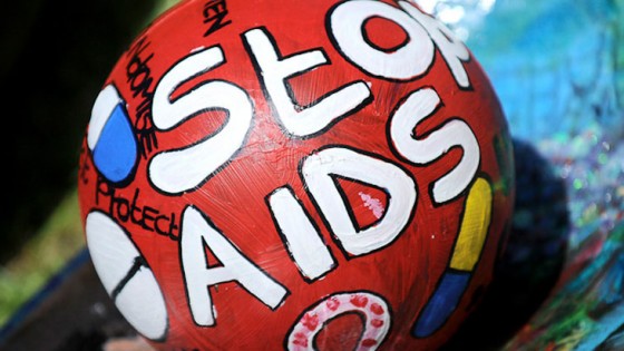 painted oware ball with "Stop AIDS" written on it
