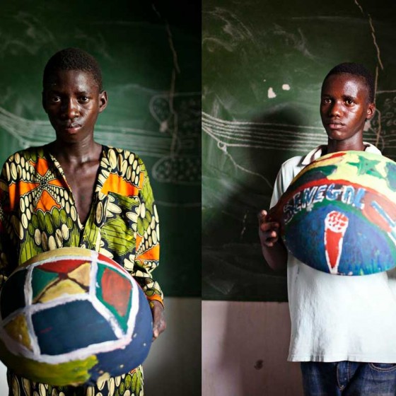 boys from Senegal holding painted bowls