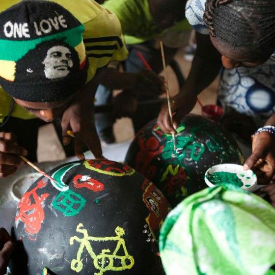 students in Senegal painting bowls