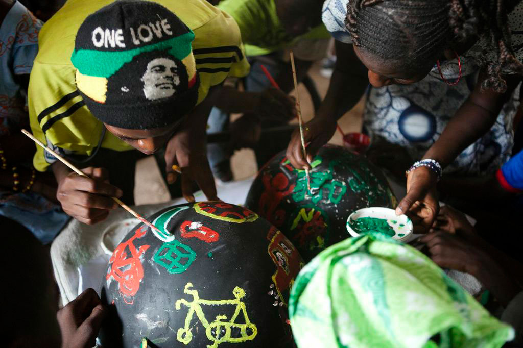 students in Senegal painting bowls