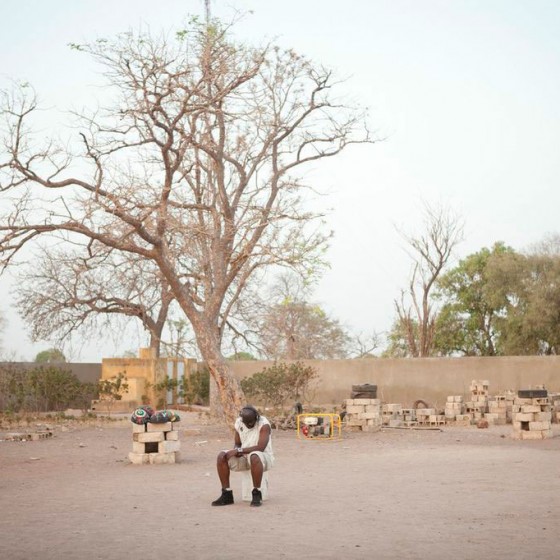 man from Senegal sitting in schoolyard