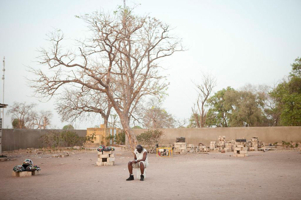 man from Senegal sitting in schoolyard