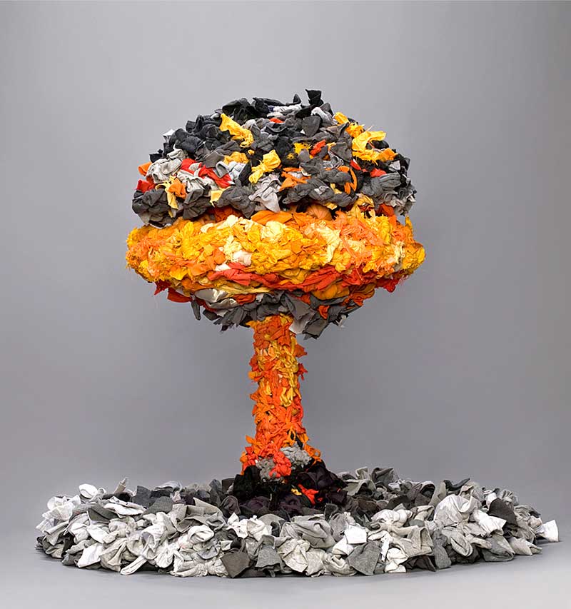 sculpture in form of mushroom cloud made from discarded textiles