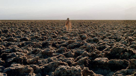 woman walking in arid landscape