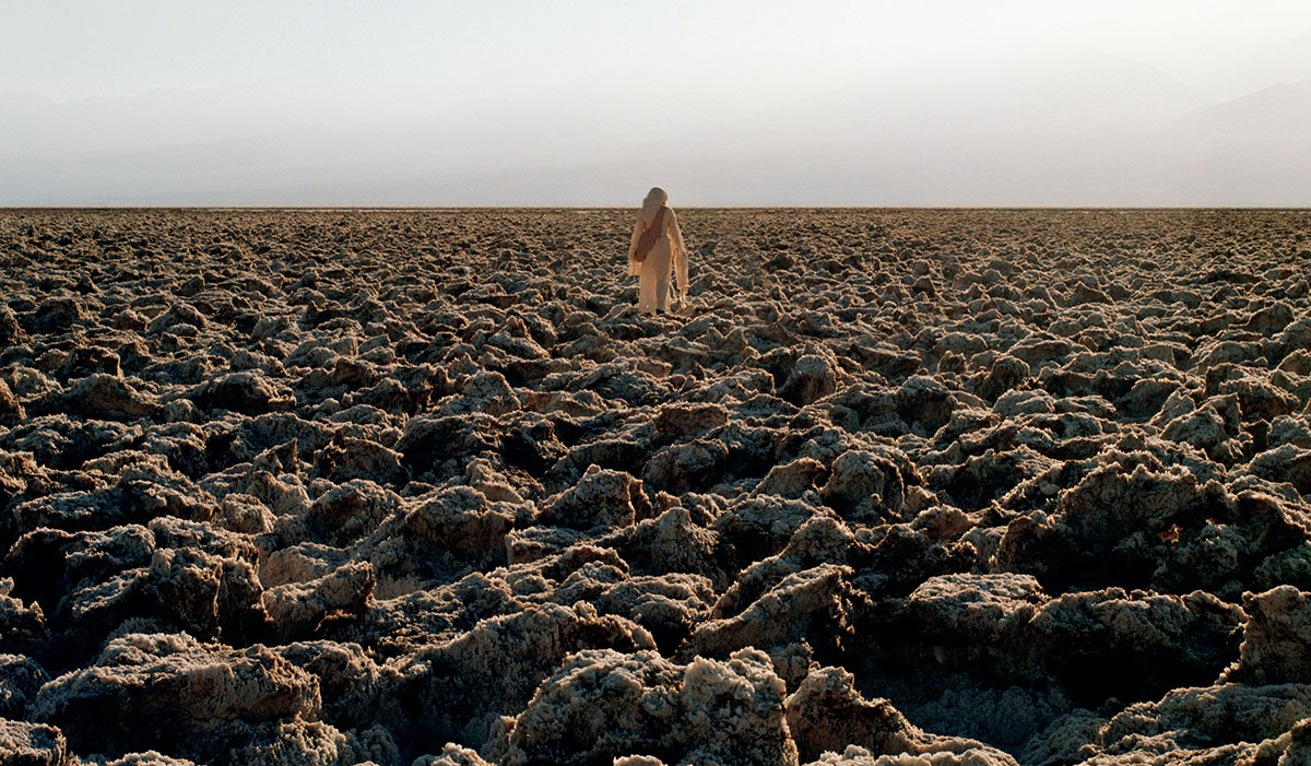 woman walking in arid landscape