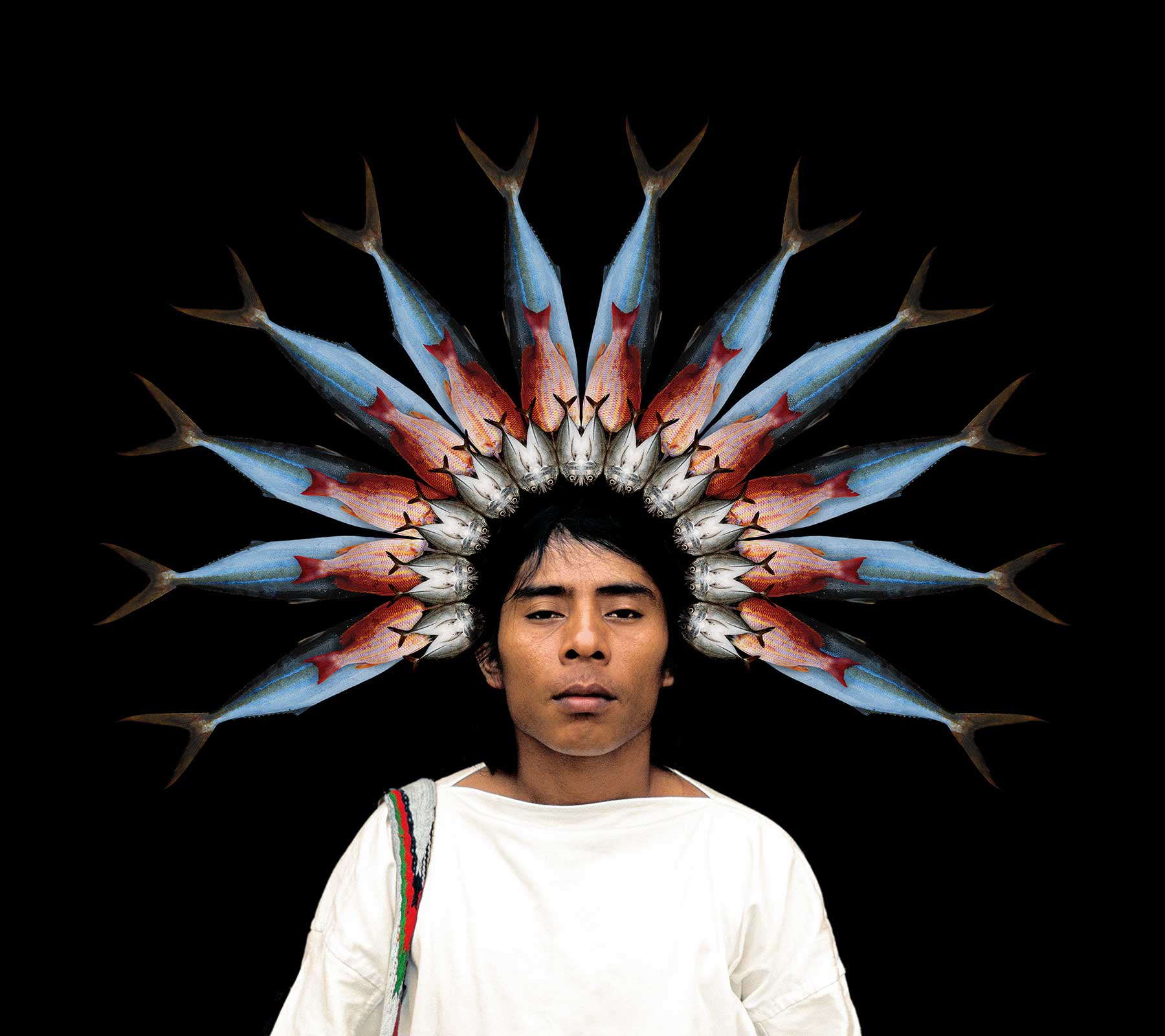 indigenous man with crown of fish