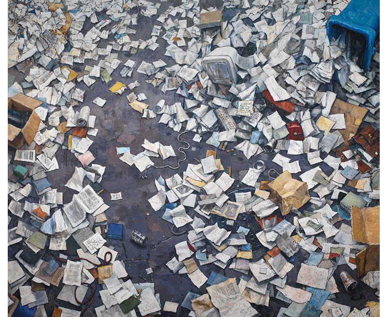 paper and trash scattered on ground