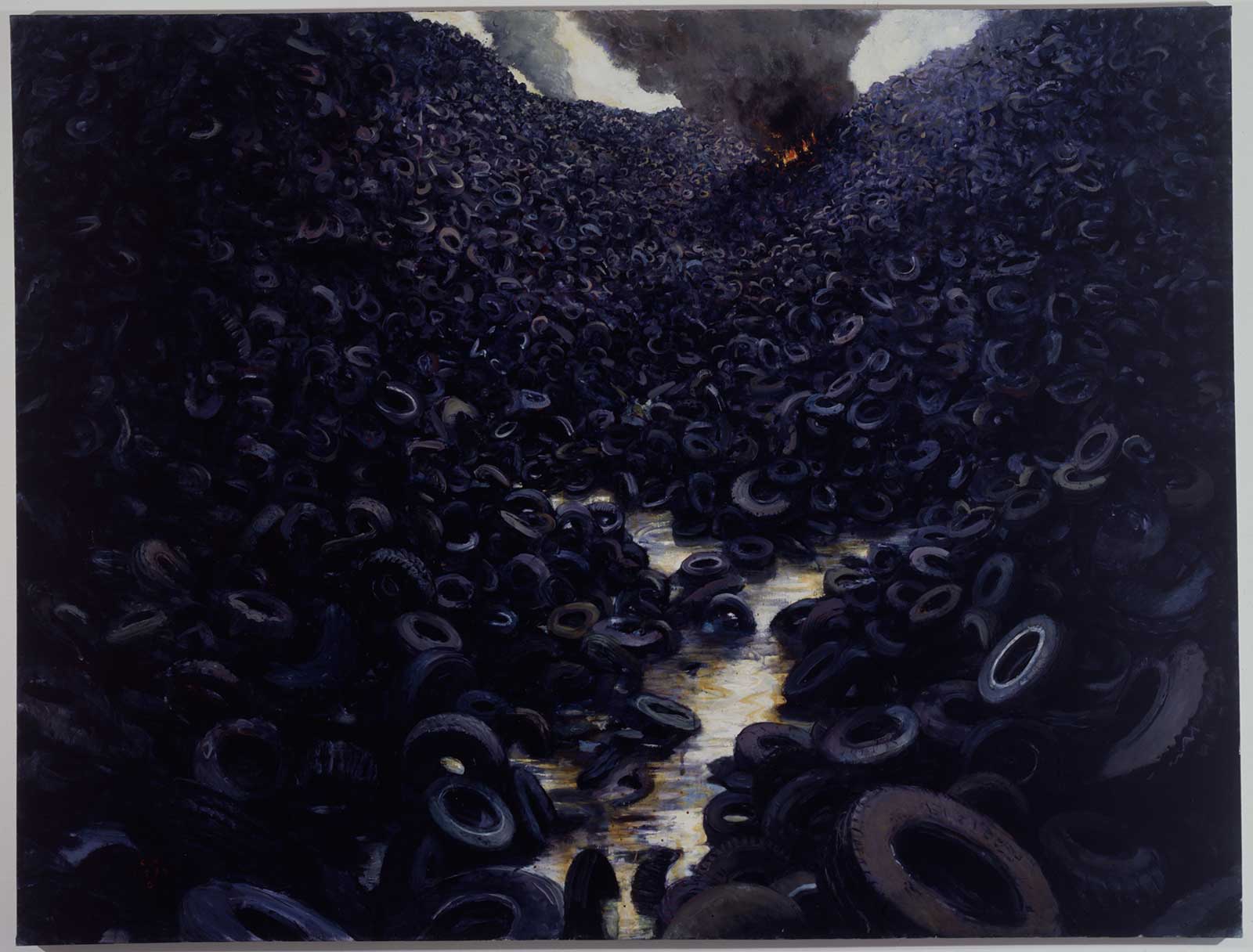 piles of tires with fire