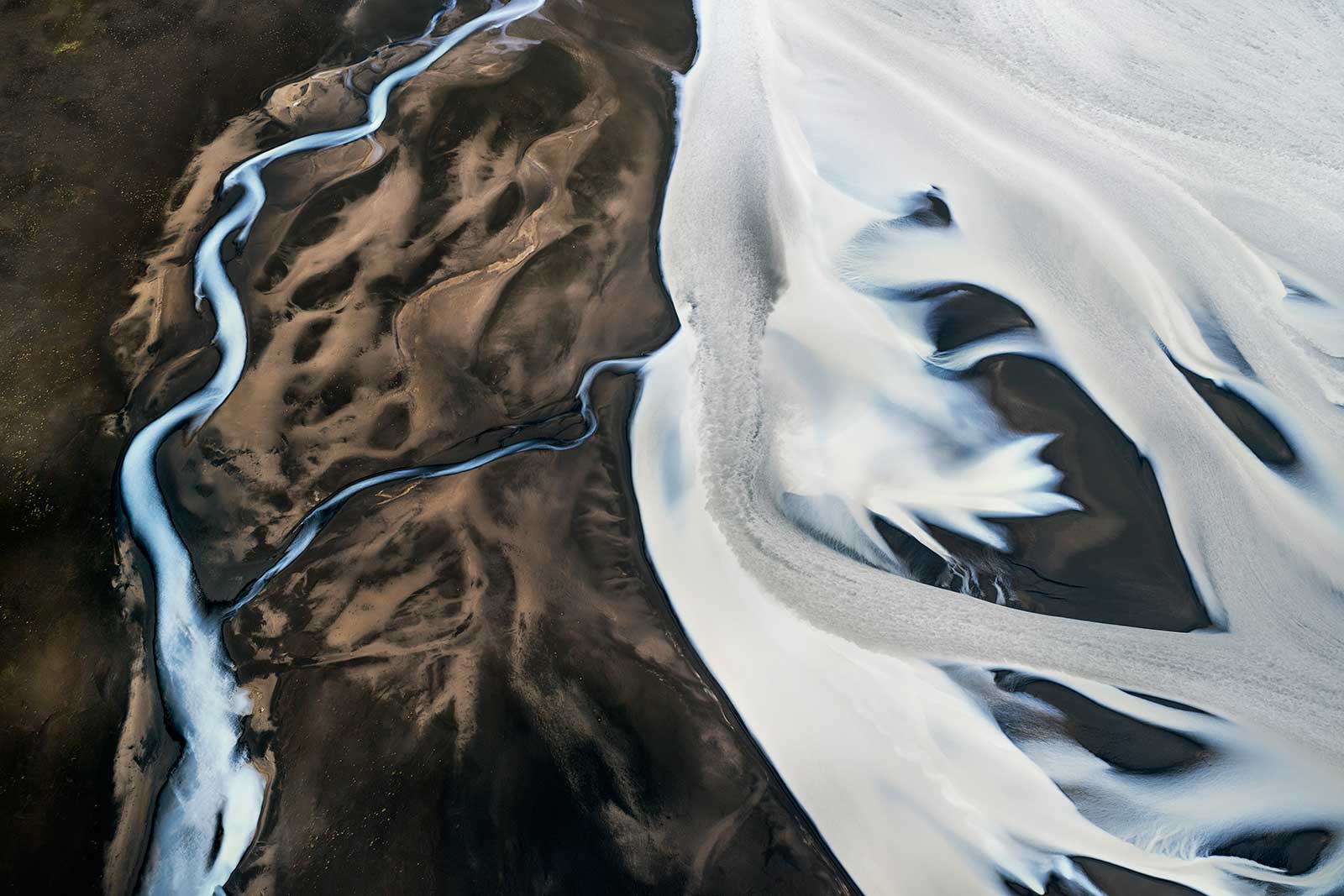 aerial view of landscape of ice and volcanic soil