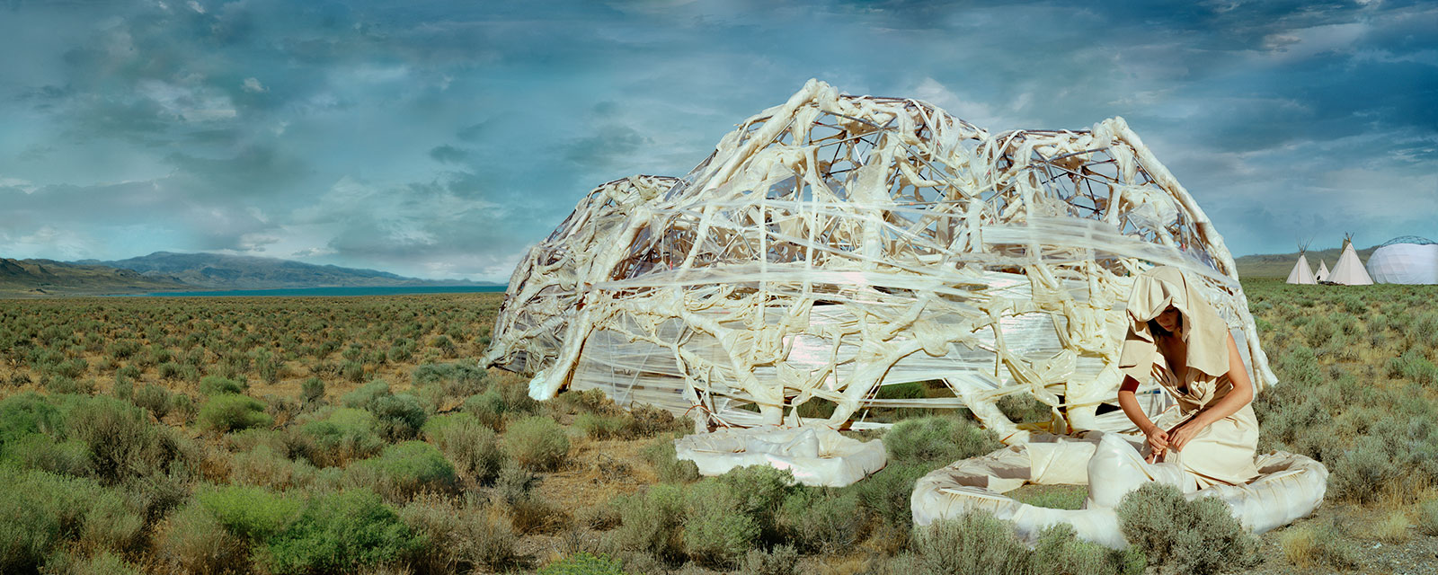 woman with portable shelter in landscape