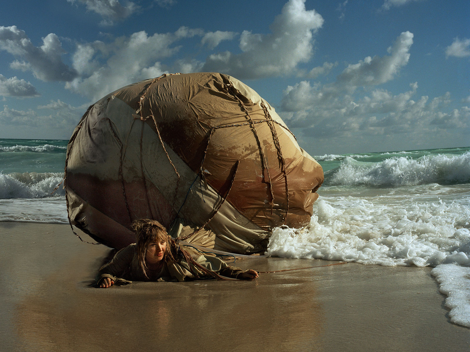 woman on shore with flotation gear