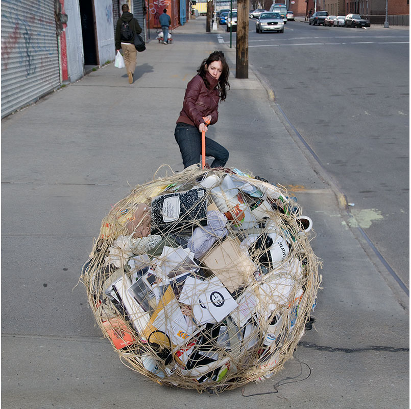 woman pulling ball of possessions