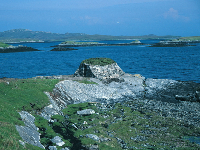 stone hut at edge of water