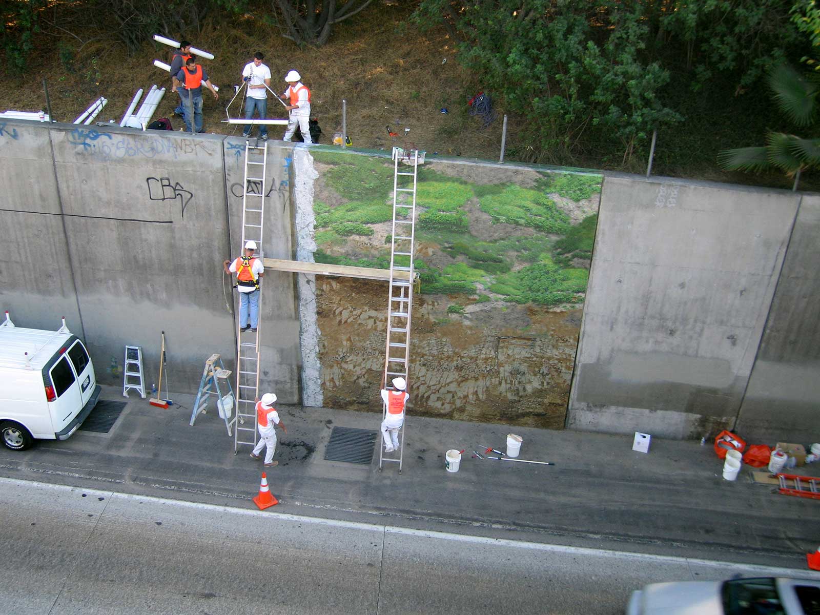 poster of natural landscape on freeway wall