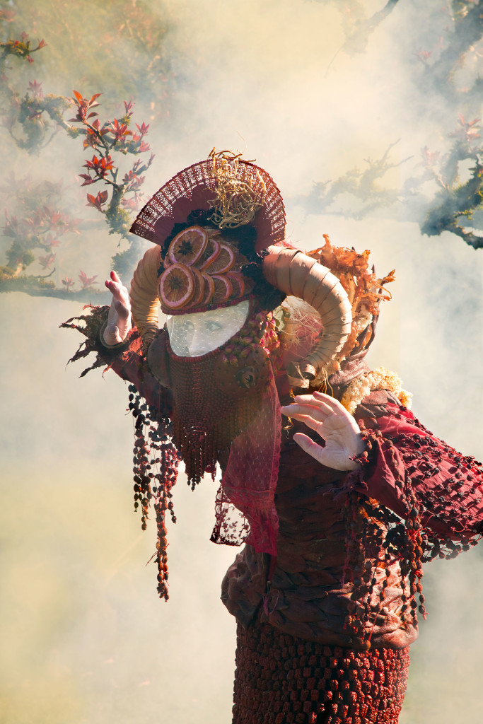 woman in red costume with smoke