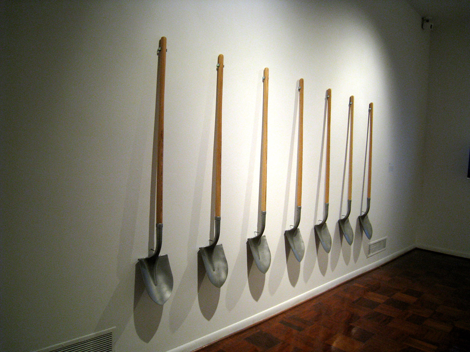 shovels hanging on a wall