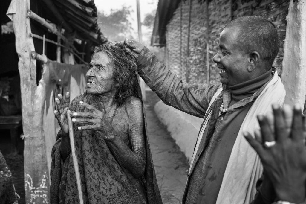 elderly woman in Nepal harassed by man