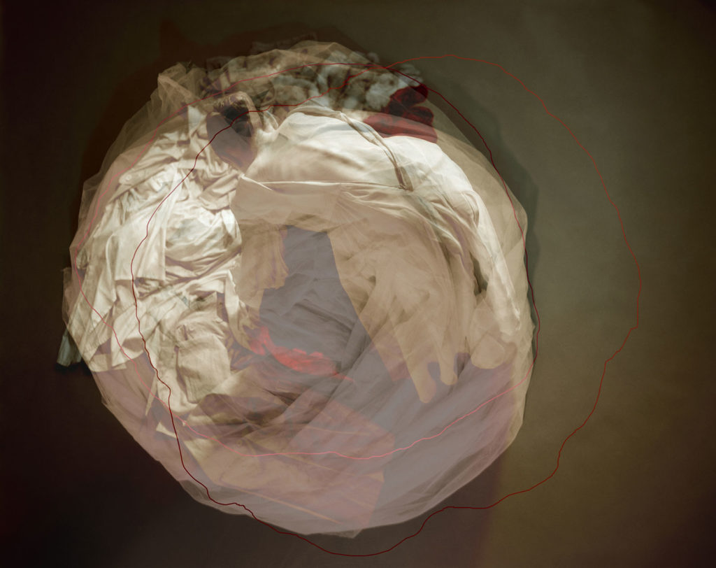 balled up clothing and possessions