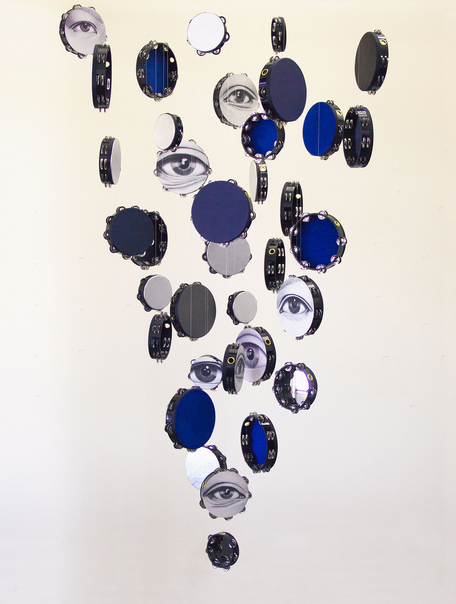 hanging tambourines with painted eyes