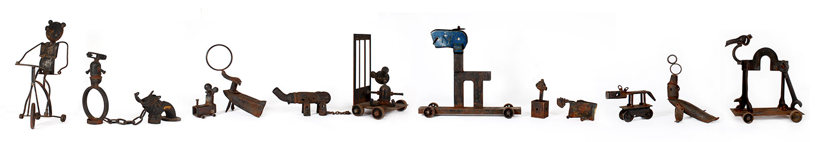 circus animals in bonds made from rusting steel