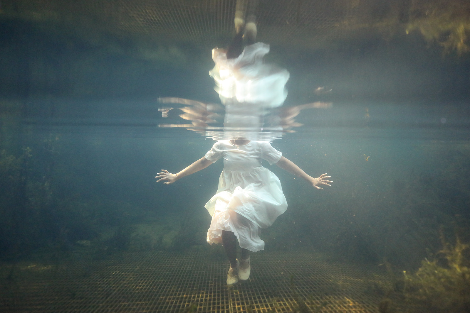 girl in water with reflection