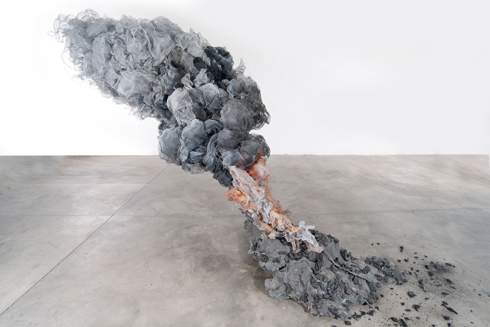 Aluminum sculpture of flames and smoke