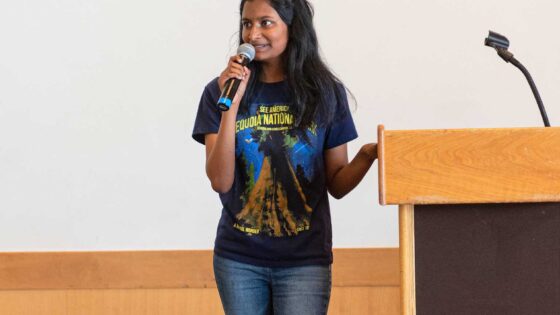 Young woman speaks at a podium